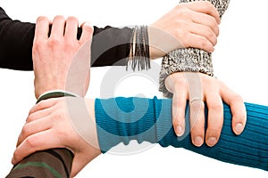 Four hands joined together