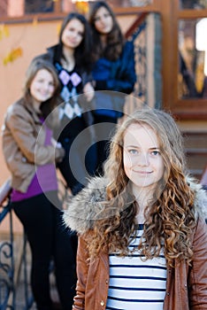 Four happy teen girls friends