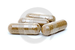 Four homeopathic brown pills photo