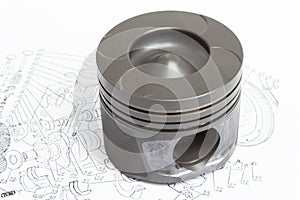 Four identical pistons on white background. spare internal combustion engine