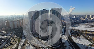 Four identical skyscrapers on a megalopolis background