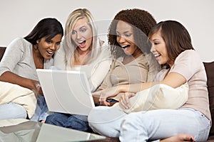 Four Interracial Girlfriends Laughing at Laptop C