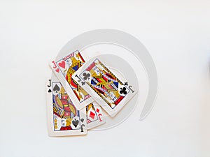 Four jacks from a deck of playing cards isolated on a white background. Pik, club, diamond and heart suit