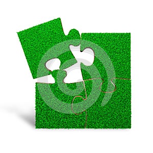 Four jigsaw puzzles with green grass, 3D illustration