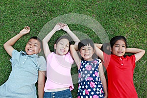 Four kids having fun in the park.