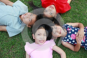 Four kids having fun in the park.
