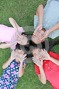 Four kids having fun in the park.