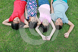 Four kids having fun in the park.
