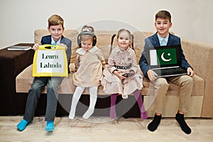 Four kids show inscription learn lahnda. Foreign language learning concept. Pakistan flag