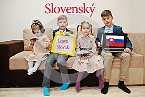 Four kids show inscription learn slovak. Foreign language learning concept. Slovensky