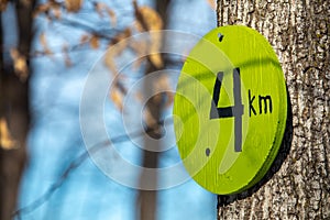 Four kilometer trail marker sign close-up