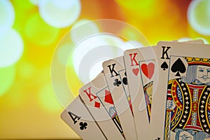 Four of a kind poker cards combination on blurred background casino game fortune luck