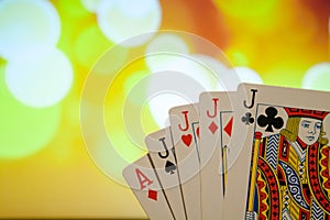 Four of a kind poker cards combination on blurred background casino game fortune luck