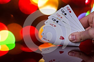 Four of a kind poker cards combination on blurred background casino luck fortune card game