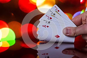 Four of a kind poker cards combination on blurred background casino luck fortune card game