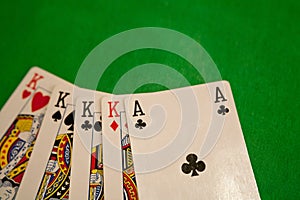 Four of a kind poker cards combination on green background casino game fortune luck