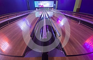 Four lane bowling alley with bumpers on for kids and beginners