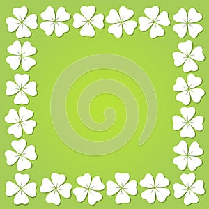 Four-leaf clover square frame isolated on a green background.