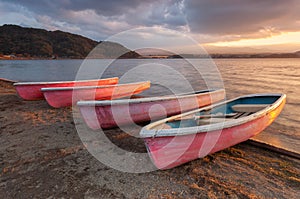 Four little boats by the sea in the evening,Thailand