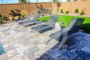 Four Lounge Chairs On Back Patio