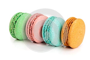 Four macaroons isolated on white background closeup