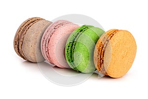 Four macaroons isolated on white background closeup