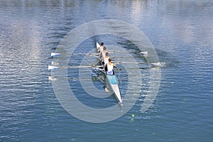 Four men rowing