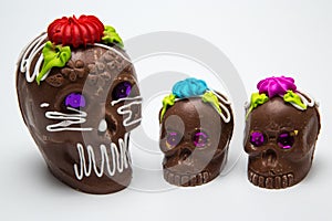 Four Mexican Calaverita de azucar Candy Skull and Calaverita de Chocolate,