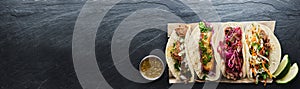 Four mexican street tacos with fish barbacoa and carnitas photo