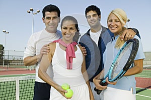 Four mixed doubles tennis players