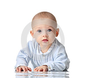 Four month Infant child baby boy in blue cloth lying happy looking at the camera isolated