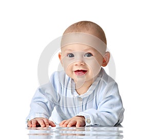 Four month Infant child baby boy in blue cloth lying happy looking at the camera isolated