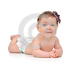 Four month Infant child baby girl in diaper lying happy smiling