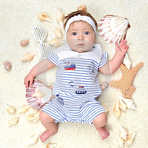 Four month Infant child baby girl lying on a back happy with she