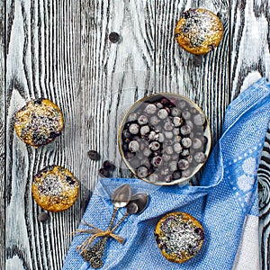 Four muffins with blackcurrant top view