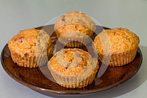 Four muffins with carrot, walnut and cinnamon