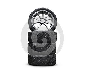 Four new good-looking snow tires isolated on the white background. A set of studded winter car tires. A set of wheels and tyre pac