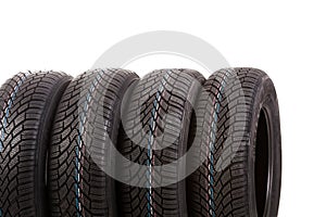 Four new tires isolated on white background