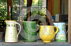 Four old ceramic pitchers