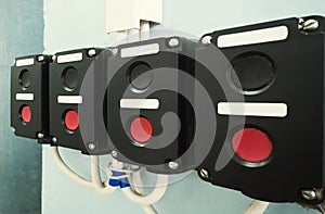 Old electrical switches on the wall in a factory