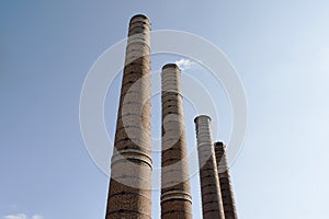 Four old industrial chimneys