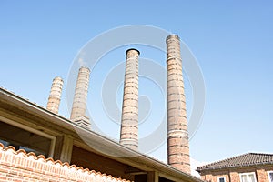 Four old industrial chimneys