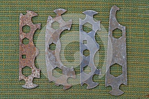 Four old rusty iron bicycle tool