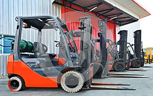 Parked Forklifts in warehouse front photo