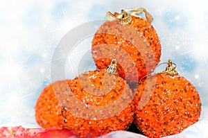 Four Orange glittering Christmas balls