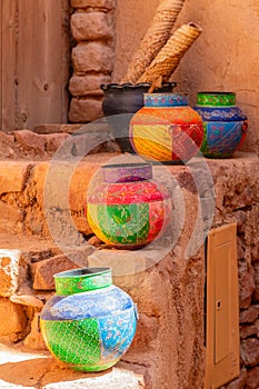 Four ornated traditional decorated arabic jars standing on street of Al Ula, Medina province, Saudi Arabia