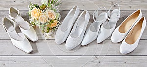 Four pairs of different white wedding shoes