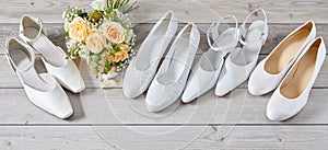 Four pairs of different white wedding shoes photo