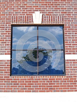 Four Paned Window on a Red Brick Wall