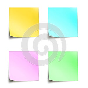 Four pastel colored sticky notes